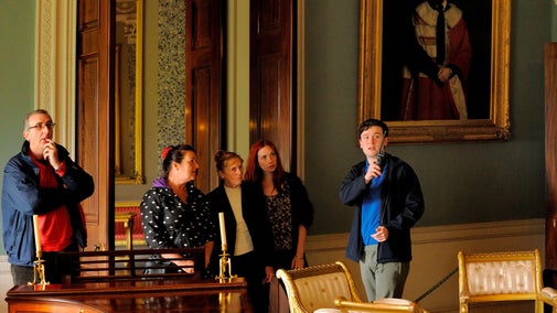 Group enjoy house tour of Castle Coole